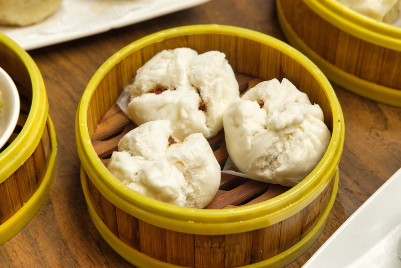 Steamed Pork Buns in Bamboo Steamer